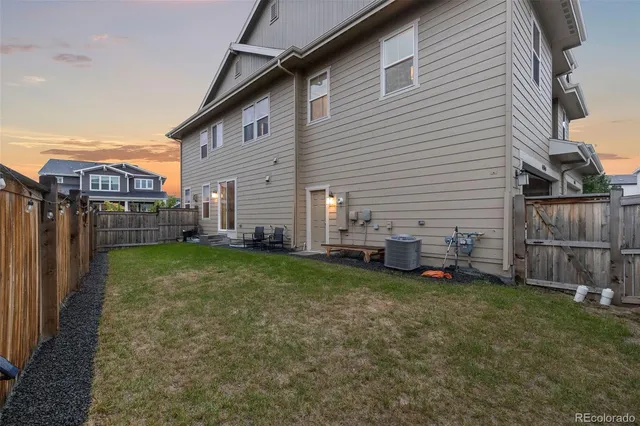 a view of a backyard with parked area