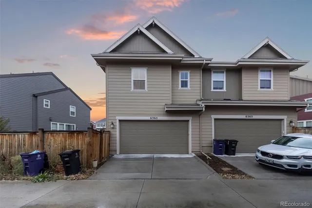 a front view of a house with a garage