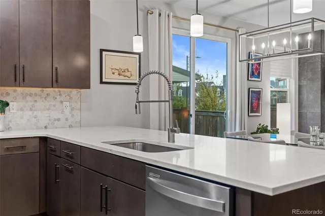 a kitchen with a sink and a refrigerator