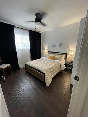 a bedroom with a bed and a mirror