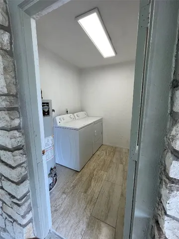a bathroom with a sink toilet and mirror