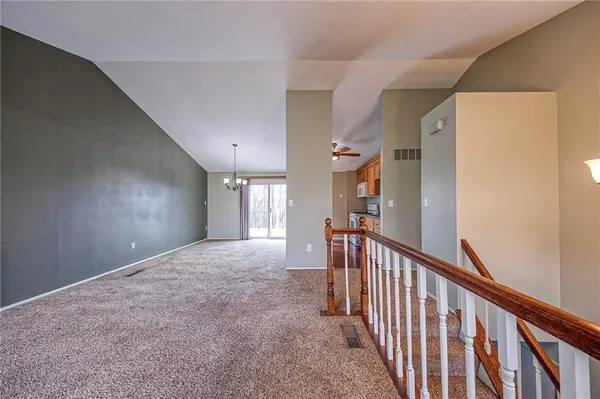 an empty room with a empty space and a ceiling fan