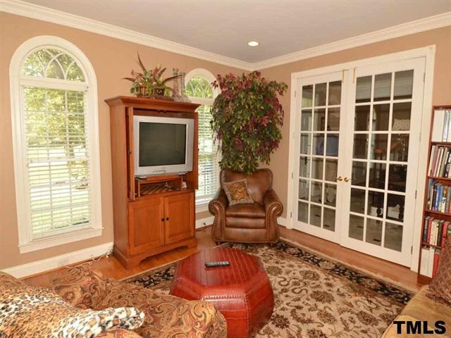 1701 Liatris Lane Raleigh, NC 27613 - Photo 3 of 25 HW FLOORS, ENTENSIVE TRIM AND MOLDINGS, WOODEN BLINDS, IN FLOOR ELECTRIC OUTLET Living Room
