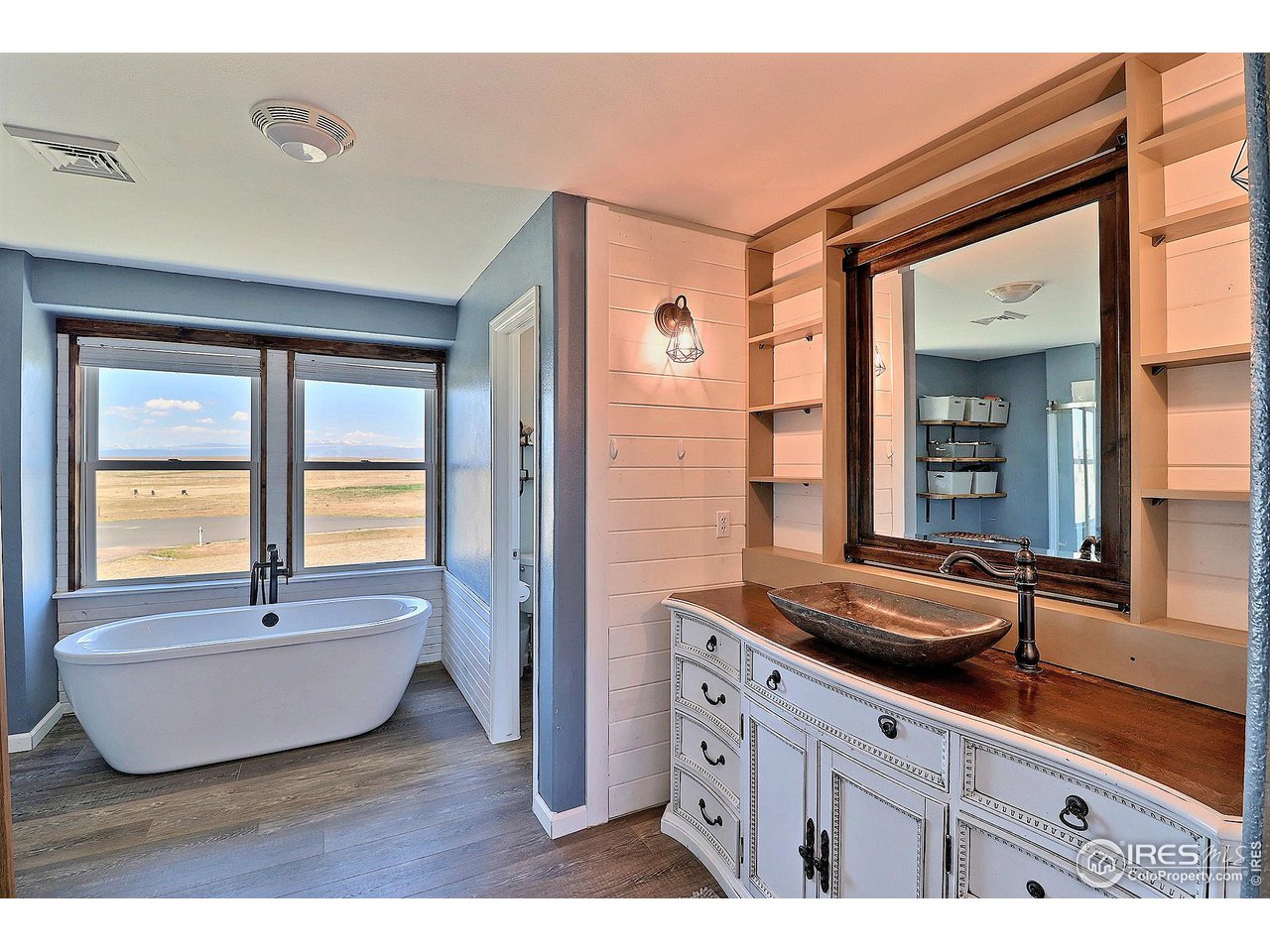 8416 Shire Road Nunn, CO 80648 - Photo 20 of 39 Primary 5 piece ensuite with soaker tub and custom vanity.