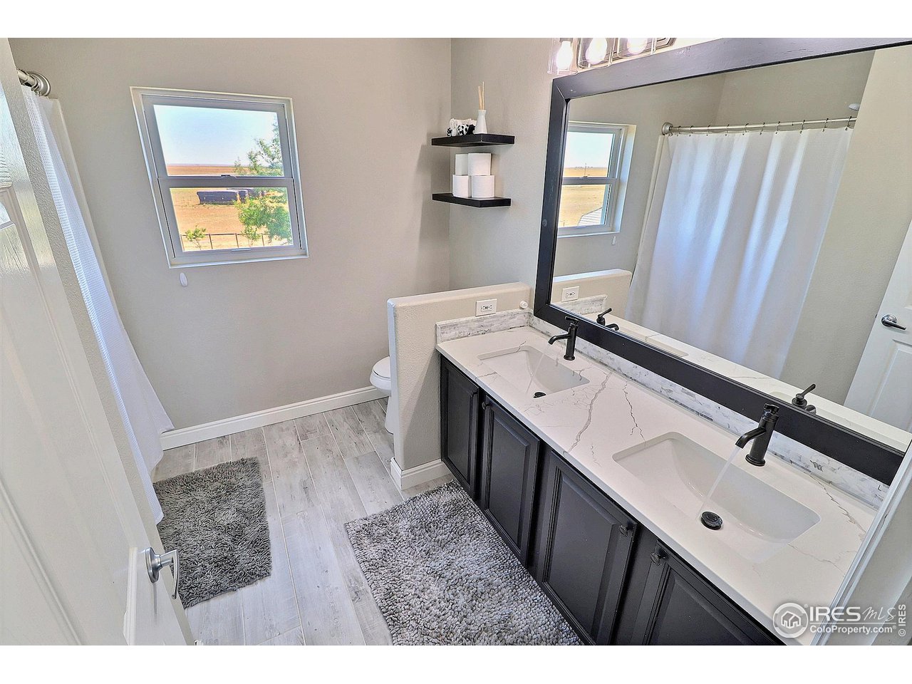 8416 Shire Road Nunn, CO 80648 - Photo 29 of 39 Shared upstairs bath with dual vanity