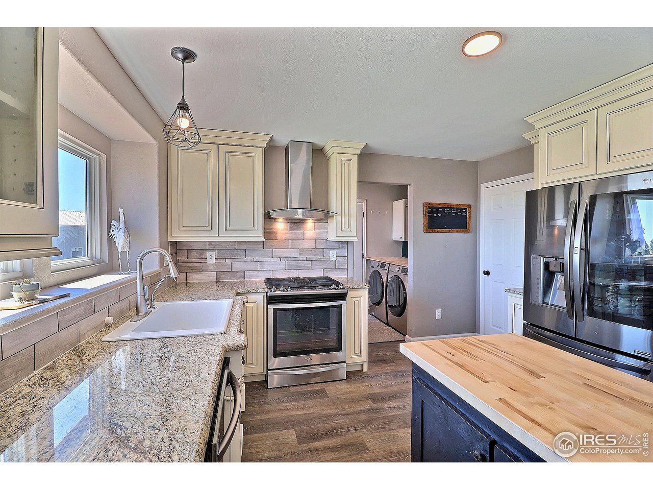 8416 Shire Road Nunn, CO 80648 - Photo 10 of 39 Granite countertops and included stainless appliances make this a lovely and functional work space.