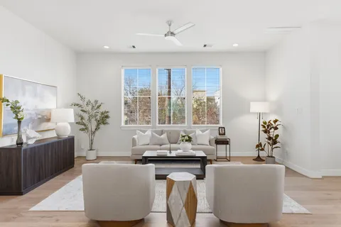 a living room with furniture and window