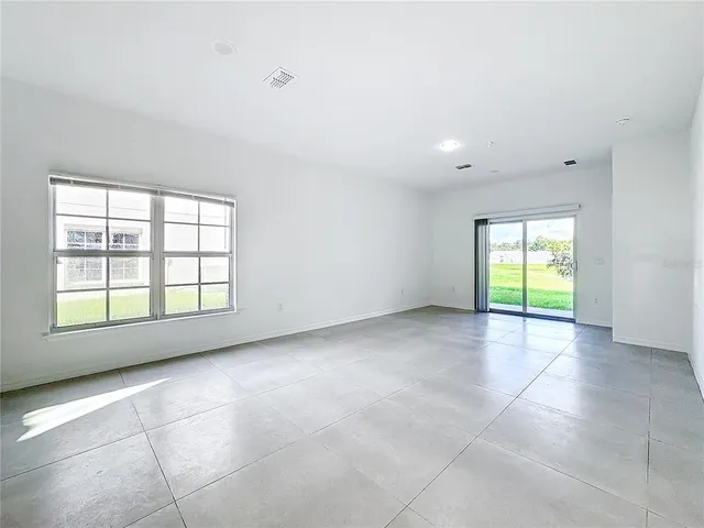 an empty room with closet area