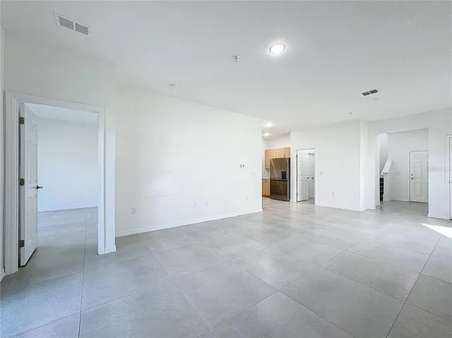 a view of an empty room and closet area