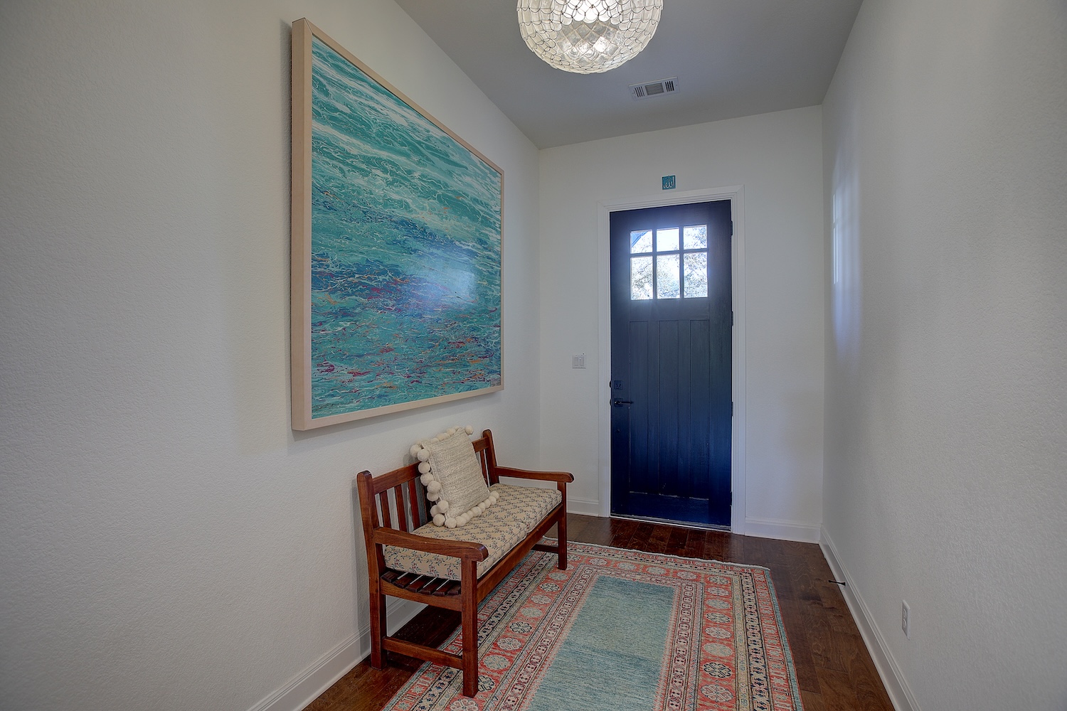 129 Hollytree Court Georgetown, TX 78628 - Photo 13 of 40 a view of a hallway with wooden floor and a workspace