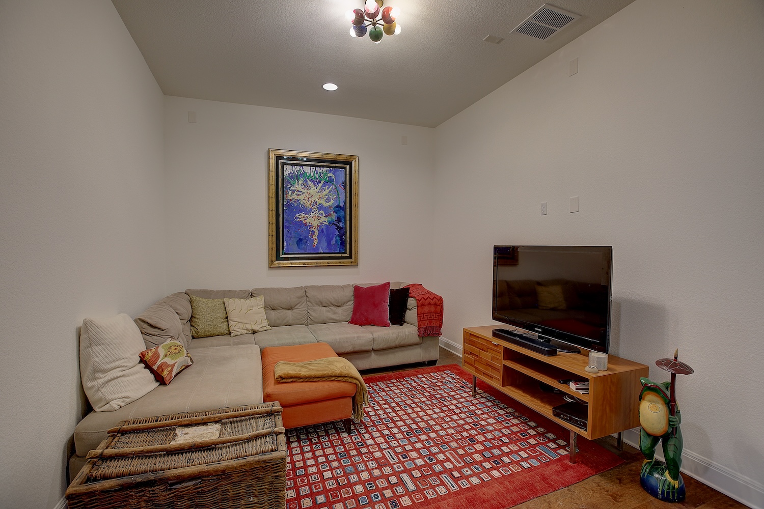 129 Hollytree Court Georgetown, TX 78628 - Photo 15 of 40 a living room with furniture and a flat screen tv