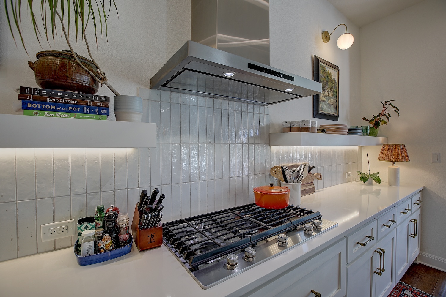 129 Hollytree Court Georgetown, TX 78628 - Photo 24 of 40 a kitchen with lots of clutter and cabinets