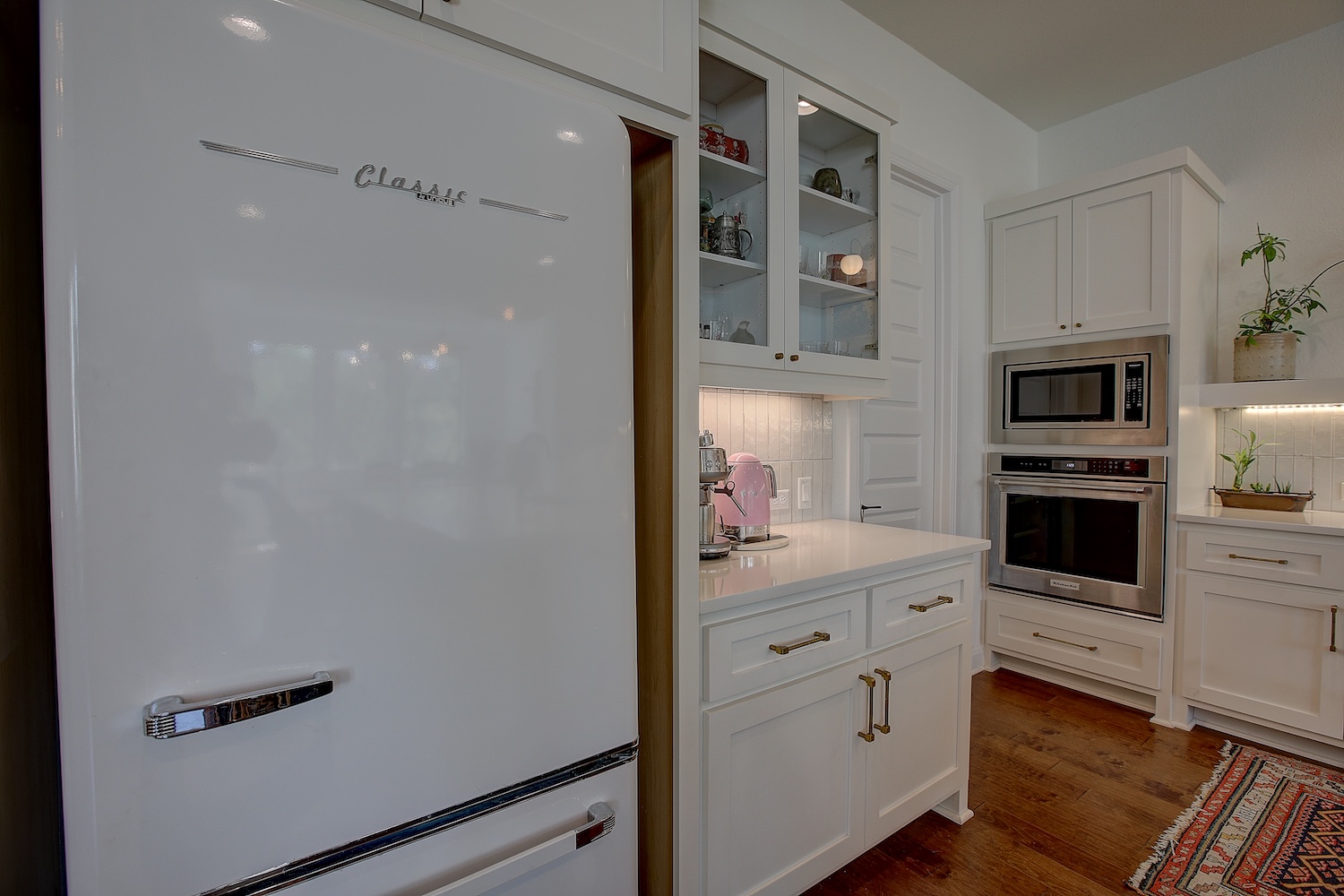 129 Hollytree Court Georgetown, TX 78628 - Photo 26 of 40 Glass front cabinets, and retro fridge adorn this modern, bright kitchen!