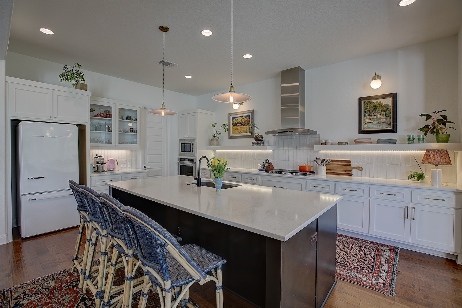 129 Hollytree Court Georgetown, TX 78628 - Photo 27 of 40 Large pantry is accessed through the doorway. Gas cooking, single bowl sink, and glass front cabinets give you space to cook like a gourmet.