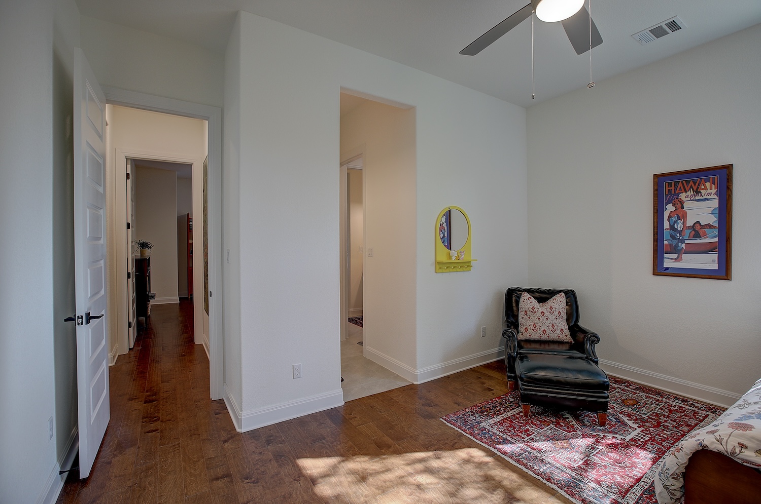 129 Hollytree Court Georgetown, TX 78628 - Photo 35 of 40 a bedroom with a bed and a chandelier fan