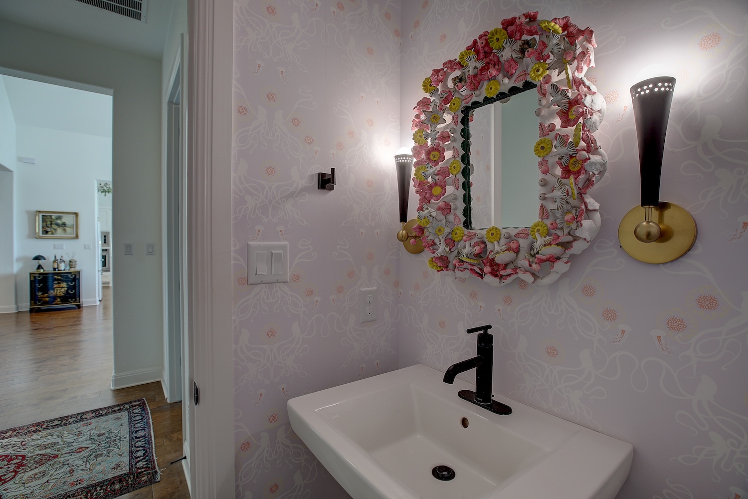 129 Hollytree Court Georgetown, TX 78628 - Photo 39 of 40 Custom lighting, and designer wallpaper adorn this guest bath. Sorry, owner is keeping the mirror, but will replace it.