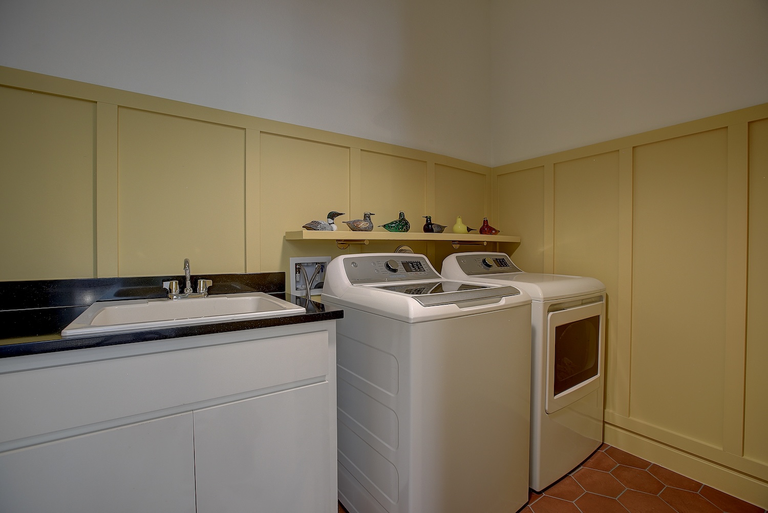 129 Hollytree Court Georgetown, TX 78628 - Photo 40 of 40 Laundry has custom wainscoting, and a sink for washables, cleaning, soaking!
