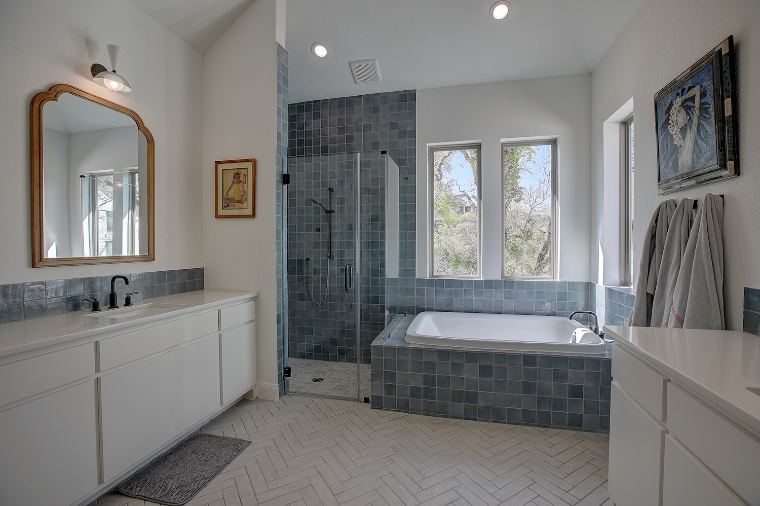 129 Hollytree Court Georgetown, TX 78628 - Photo 7 of 40 Dual vanities, relaxing aqua tiles, a walk in shower, and a soaking tub all enjoy the views of the middle San Gabriel!