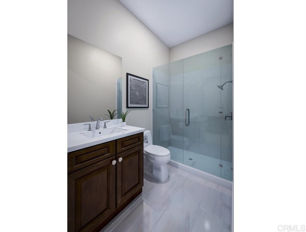 5140 Lighthouse Bend San Diego, CA 92130 - Photo 14 of 24 a bathroom with a double vanity sink toilet and shower