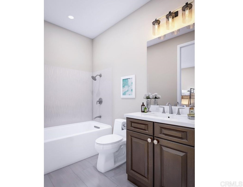 5140 Lighthouse Bend San Diego, CA 92130 - Photo 15 of 24 a bathroom with a bathtub shower sink vanity mirror and toilet