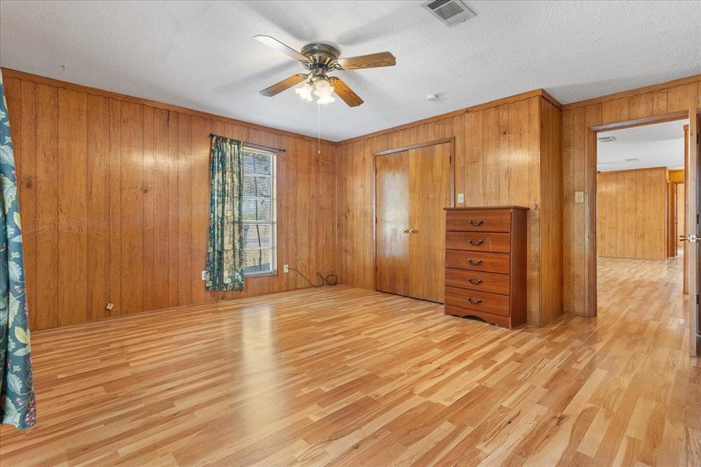 519 Tolson Avenue Van Alstyne, TX 75495 - Photo 14 of 25 wooden floor and windows in a room