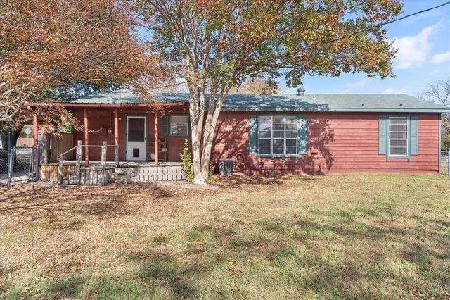 front view of a house with a big yard