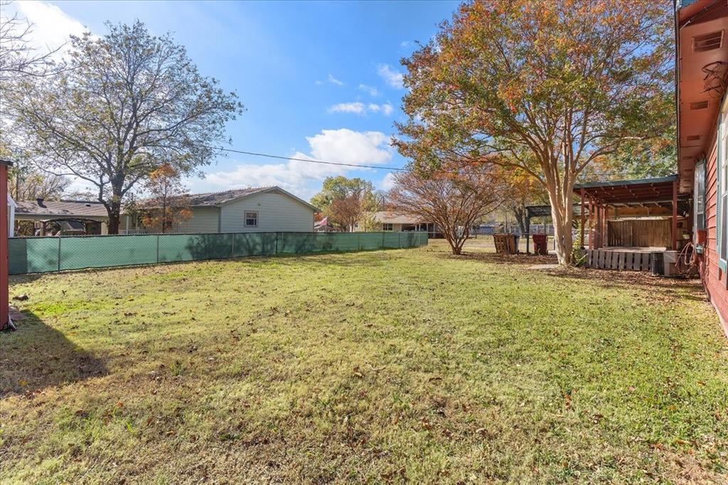 519 Tolson Avenue Van Alstyne, TX 75495 - Photo 21 of 25 a view of a backyard with a garden