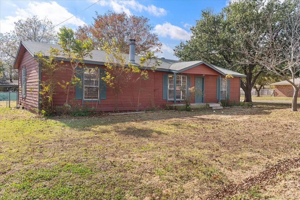 519 Tolson Avenue Van Alstyne, TX 75495 - Photo 24 of 25 a view of a house with a yard