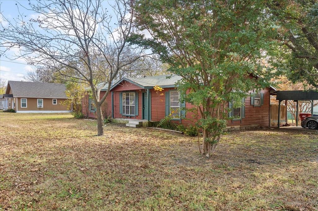519 Tolson Avenue Van Alstyne, TX 75495 - Photo 25 of 25 a house with lots of trees