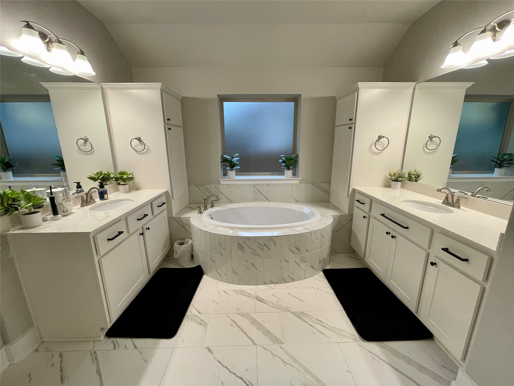 120 Sail Wind Way Georgetown, TX 78633 - Photo 15 of 25 a bathroom with a double vanity sink a mirror a toilet and a bathtub