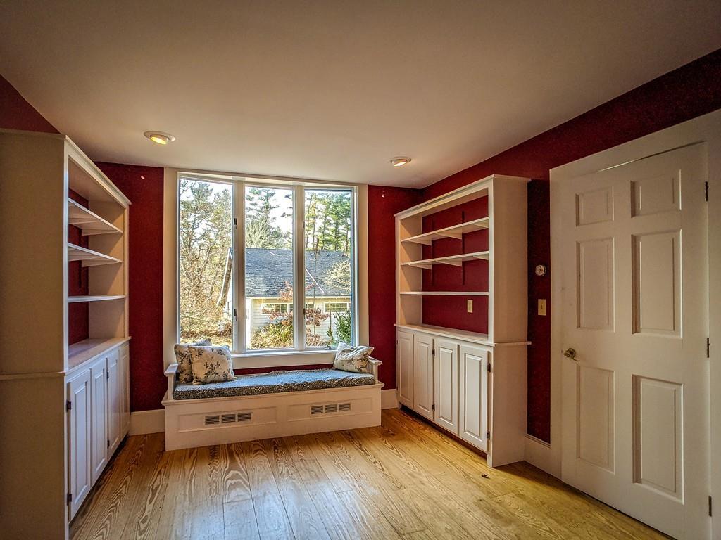 678 Point Road Marion, MA 02738 - Photo 4 of 33 a view of an empty room with a window and wooden floor