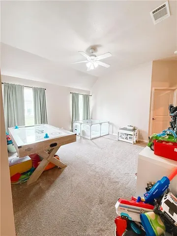 a bed room with furniture and a table