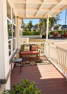 a view of a wooden deck with outdoor seating