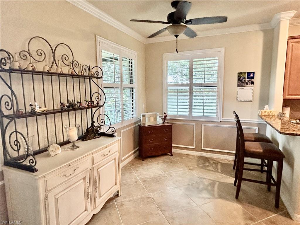 9511 Napoli Lane, Unit 202 Naples, FL 34113 - Photo 19 of 50 a bedroom with furniture and a window