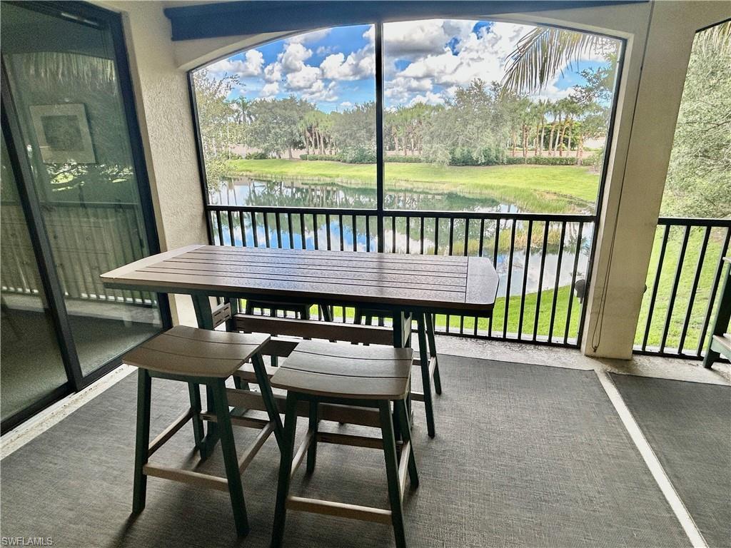 9511 Napoli Lane, Unit 202 Naples, FL 34113 - Photo 20 of 50 a view of a chairs and table in the balcony