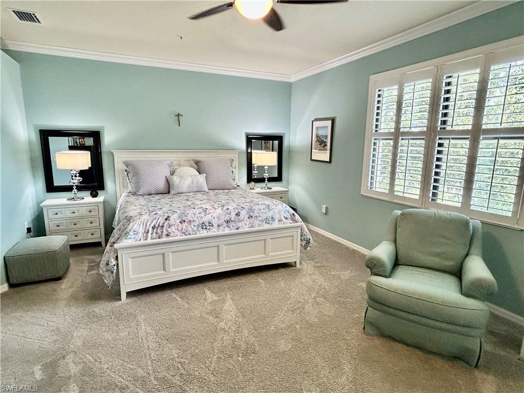 9511 Napoli Lane, Unit 202 Naples, FL 34113 - Photo 24 of 50 a bedroom with bed couch and window