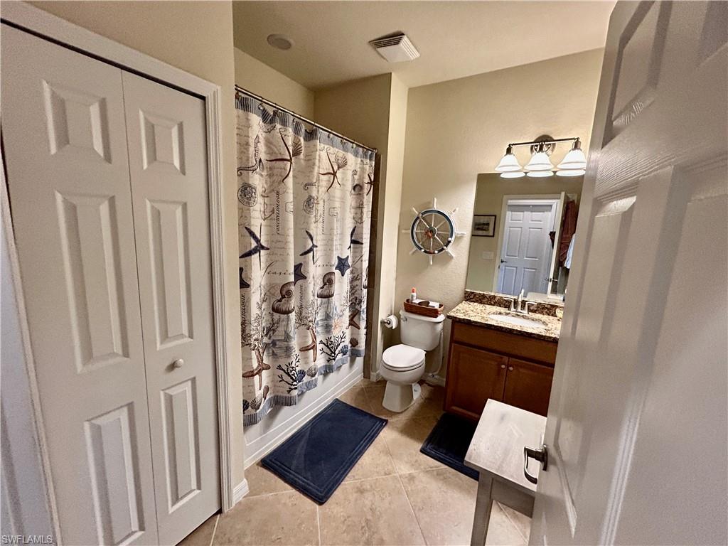 9511 Napoli Lane, Unit 202 Naples, FL 34113 - Photo 33 of 50 a bathroom with a sink toilet and shower