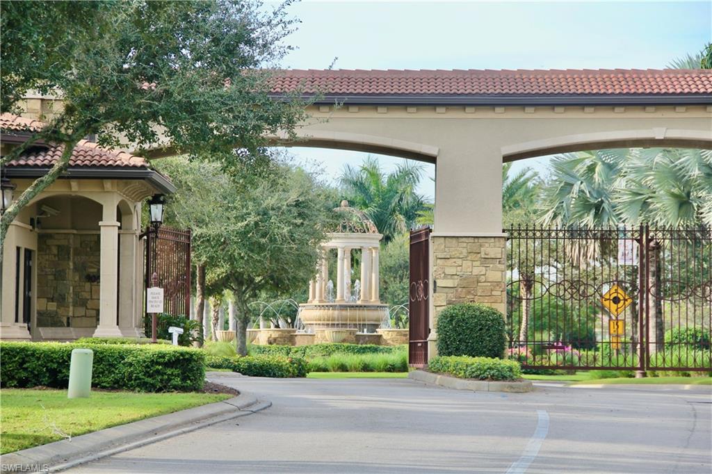 9511 Napoli Lane, Unit 202 Naples, FL 34113 - Photo 37 of 50 a front view of a house with a garden