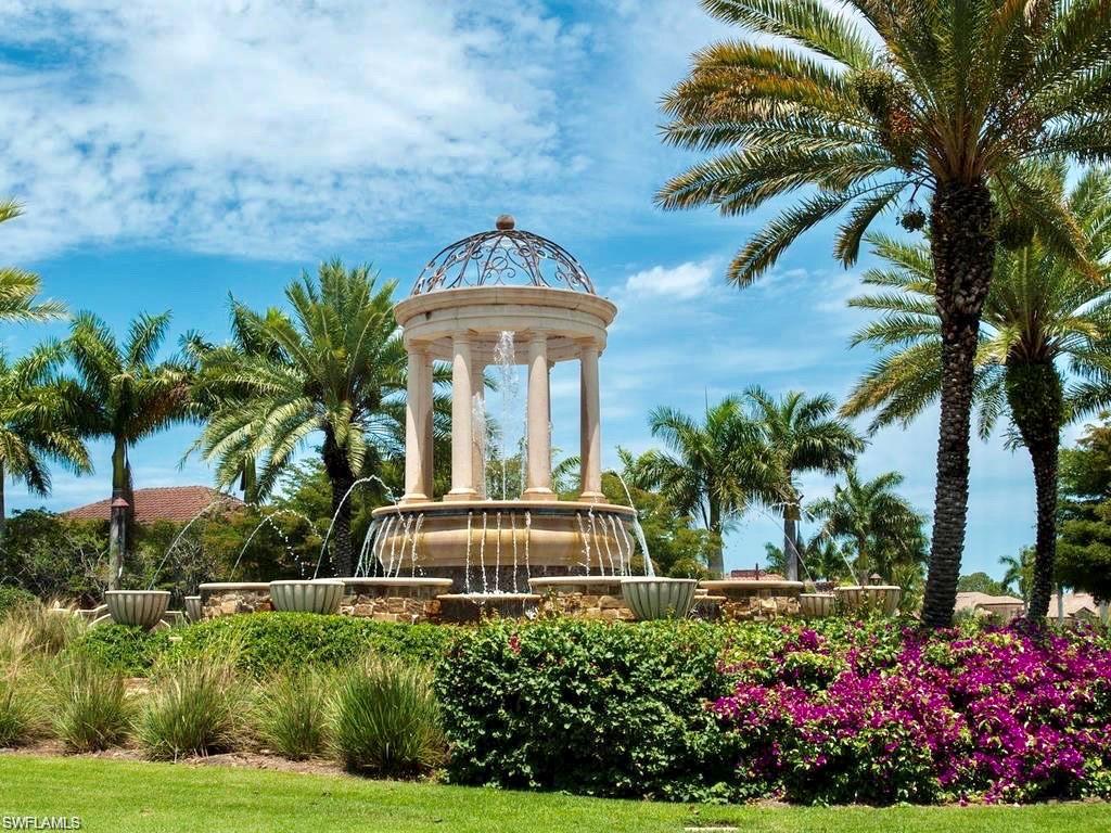 9511 Napoli Lane, Unit 202 Naples, FL 34113 - Photo 38 of 50 a front view of a house with a yard