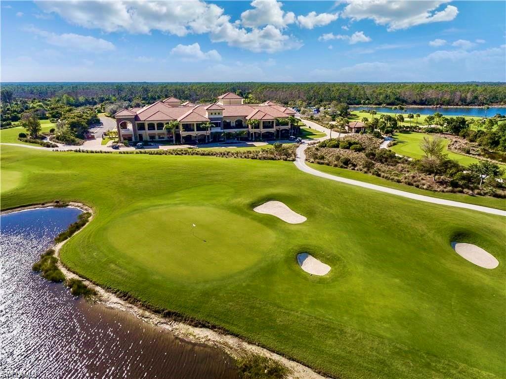 9511 Napoli Lane, Unit 202 Naples, FL 34113 - Photo 41 of 50 a view of a lake with a mountain