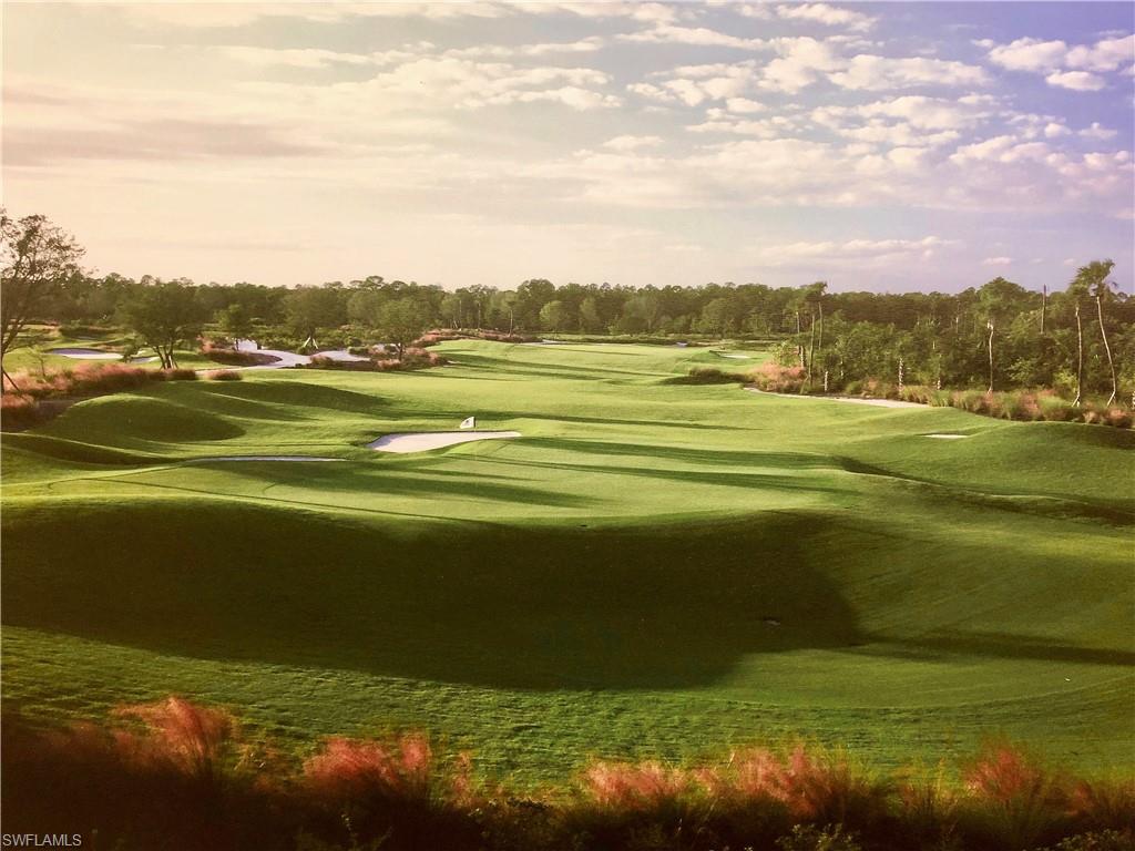 9511 Napoli Lane, Unit 202 Naples, FL 34113 - Photo 42 of 50 a view of an ocean and beach