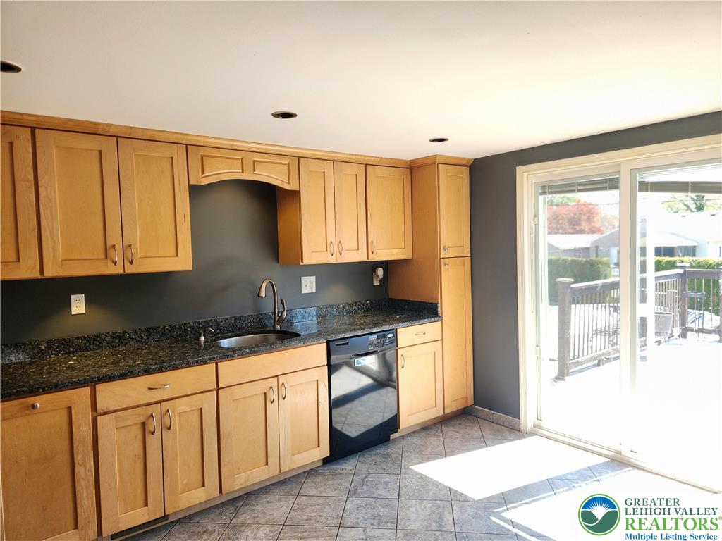 18 George Avenue Nazareth, PA 18064 - Photo 3 of 15 a kitchen with granite countertop a stove a sink and a granite counter tops