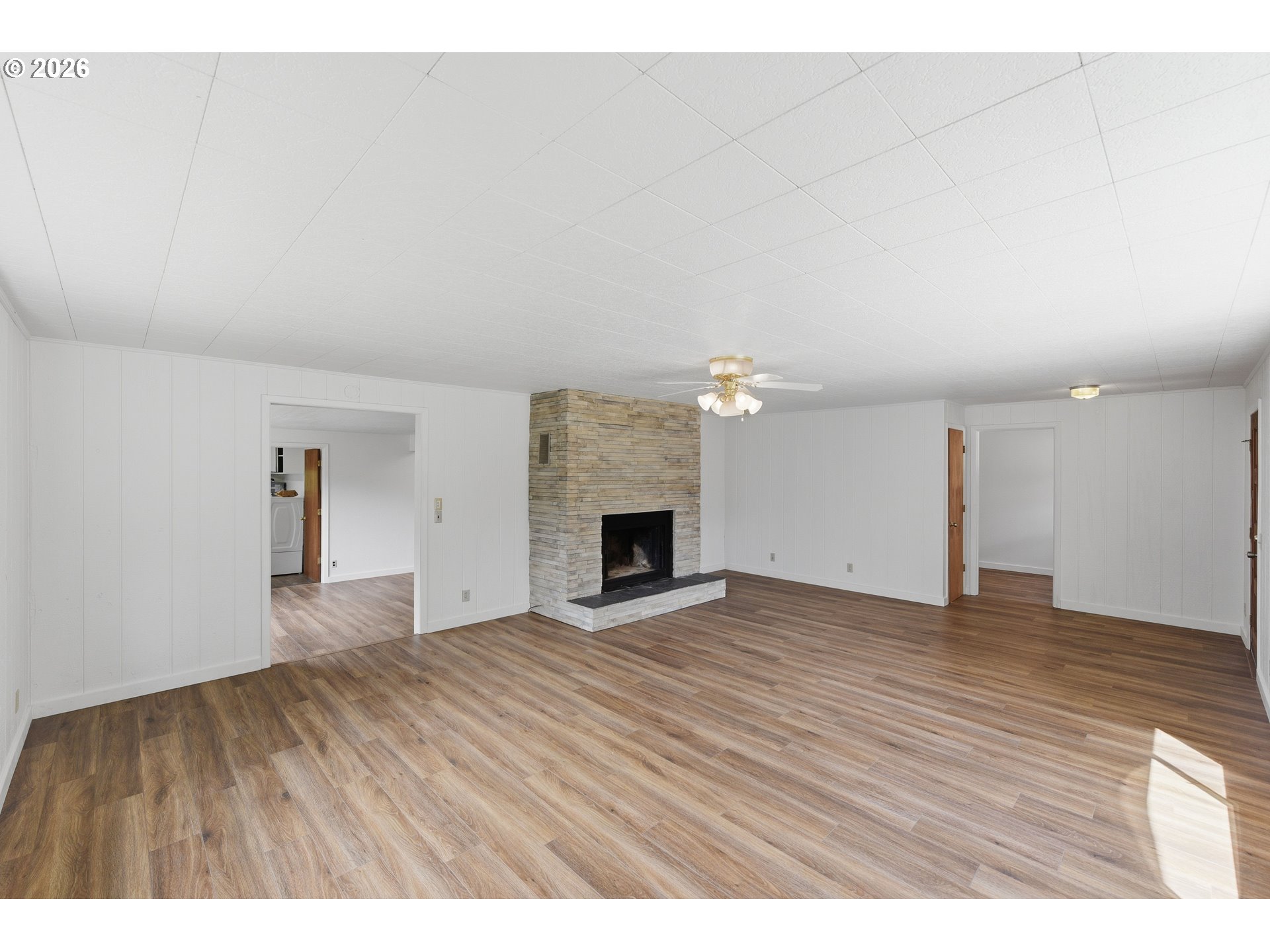 63299 Wildahl Road Coos Bay, OR 97420 - Photo 12 of 45 a view of an empty room with a fireplace and a window