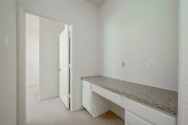 a view of storage and utility room in white wall