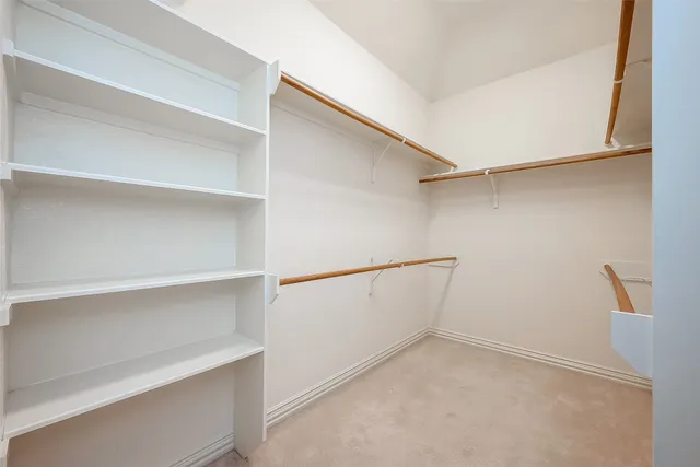 a view of an empty walk in closet