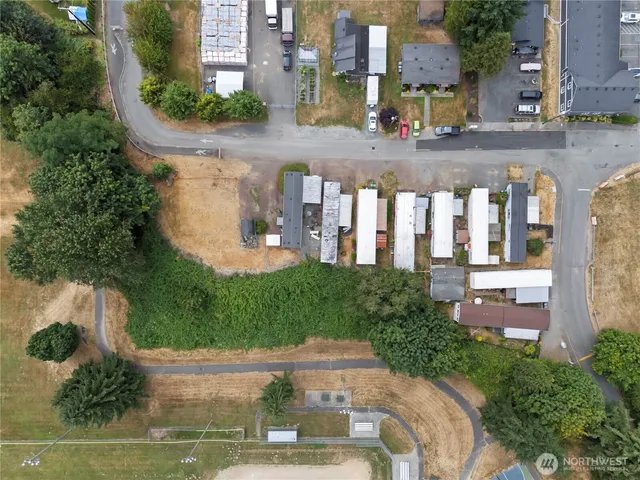 a view of building along with street and trees