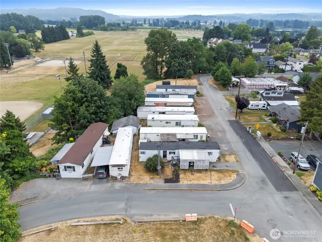 an aerial view of a house with lake view