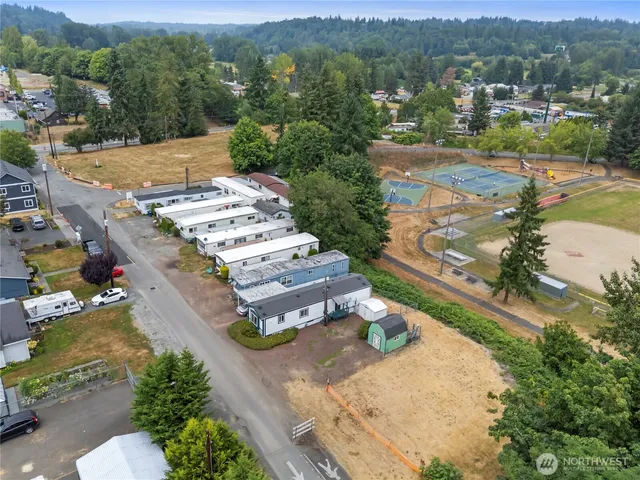 an aerial view of a house with a yard