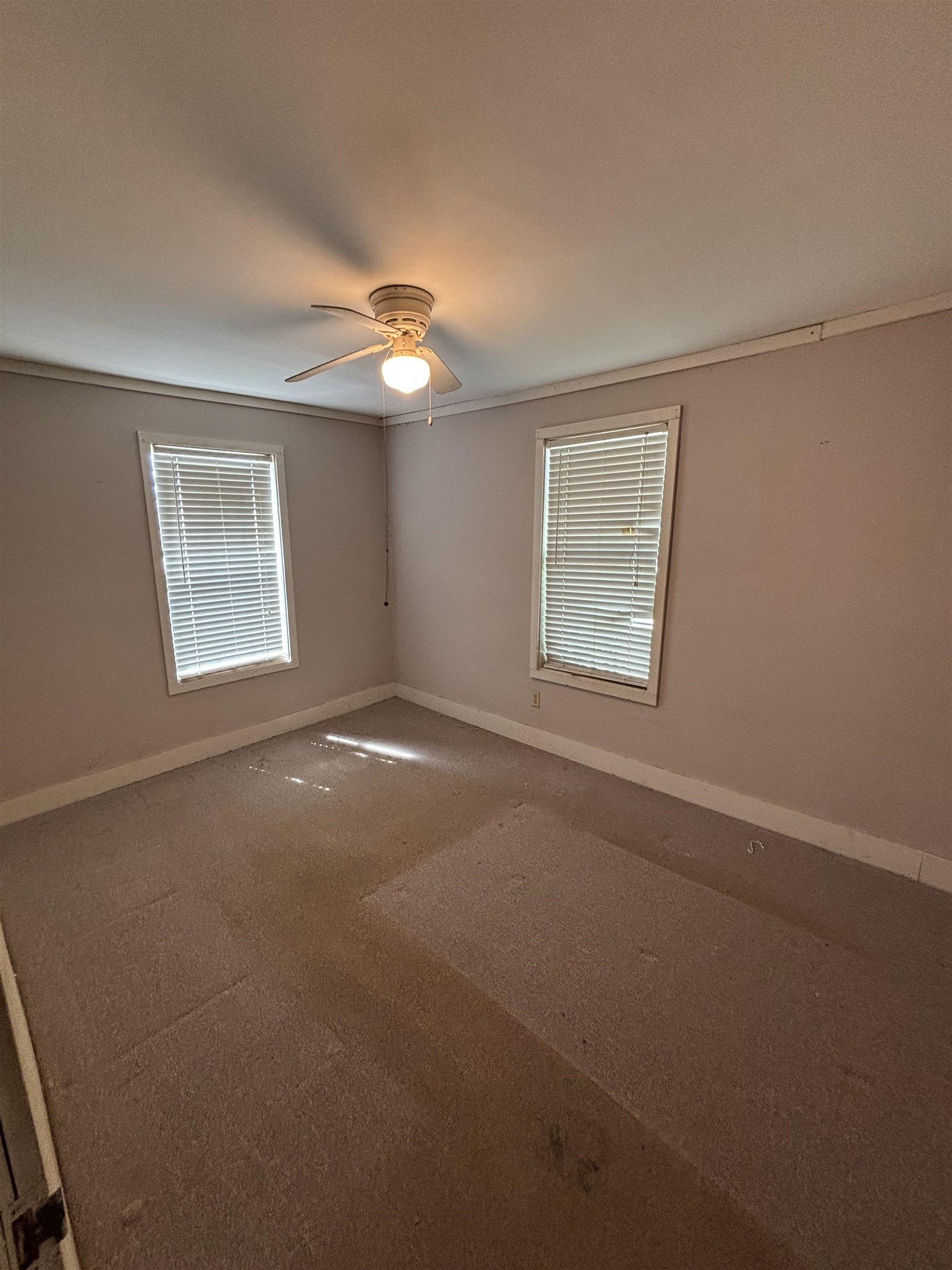 181 Deen Road Brighton, TN 38011 - Photo 12 of 16 Carpeted spare room with baseboards and crown molding