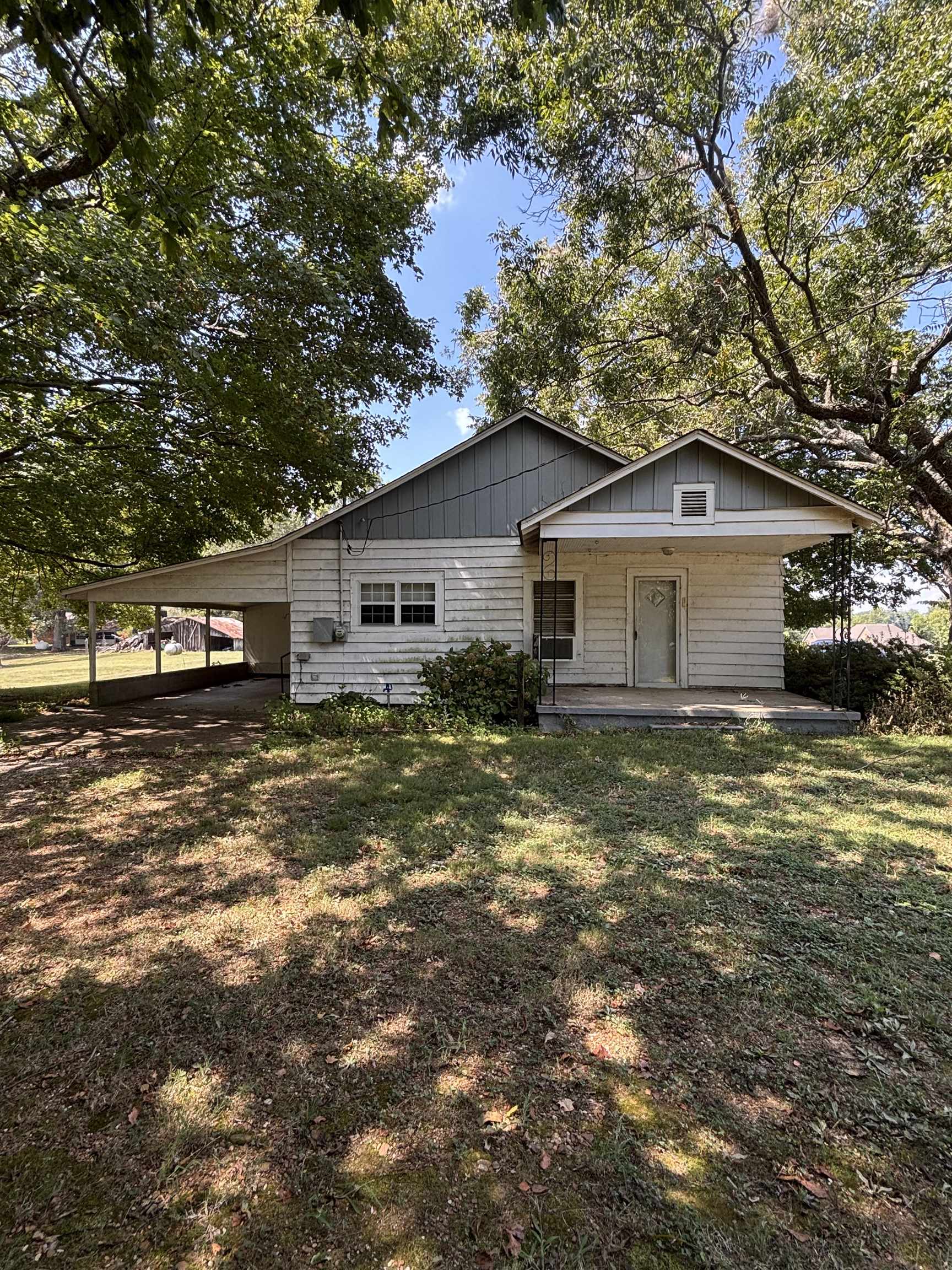 181 Deen Road Brighton, TN 38011 - Photo 4 of 16 View of front of property featuring a carport, covered porch, and a front yard